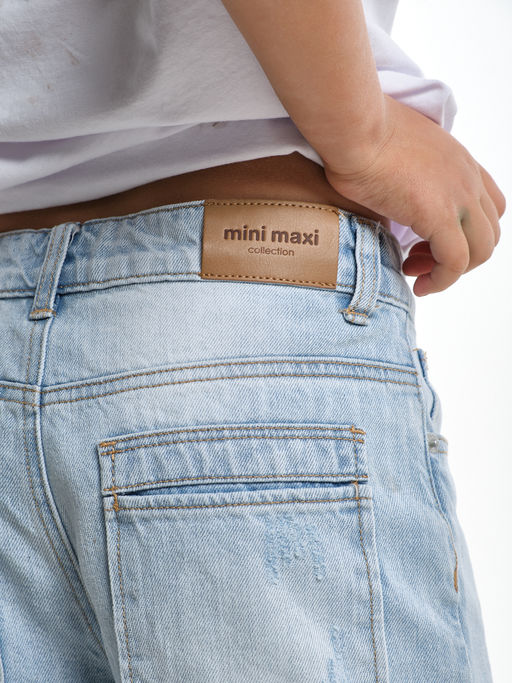 Джинсы клеш рваные для весны и лета 33-1053 св.голубой - Mini maxi фото 5