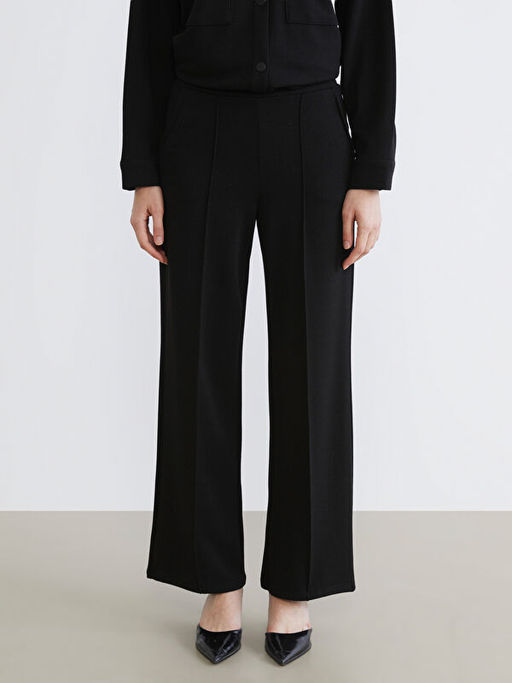 Beli Lastikli Parlak Dokulu Kad?n Pantolon