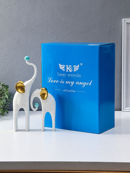 Сувенир полистоун "Слоны. Гофре" белый с золотом набор 2 шт 5х10х16,5 5,5х16,5х29,5 см