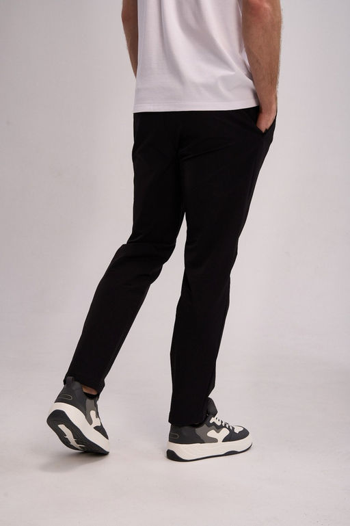 Брюки текстильные Черный TRN Woven Track Pants - Anta фото 4
