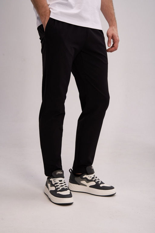 Брюки текстильные Черный TRN Woven Track Pants - Anta фото 2