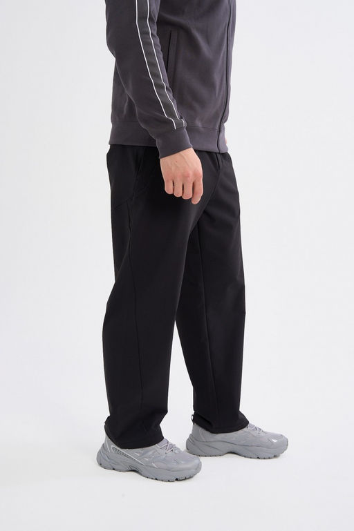 Брюки текстильные Черный ICONIC Woven Track Pants - Anta фото 4