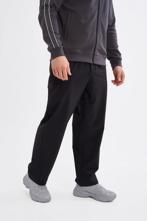 Брюки текстильные Черный ICONIC Woven Track Pants - Anta фото 3