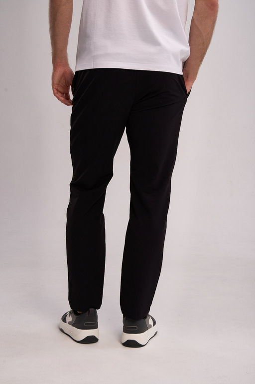 Брюки текстильные Черный TRN Woven Track Pants - Anta фото 5