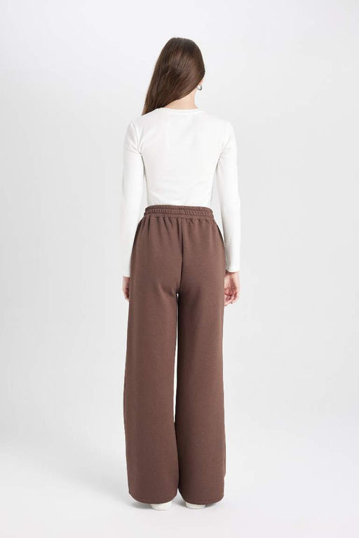 Простые спортивные штаны с широкими штанинами, эластичной талией, шнуровкой, карманами и широкими штанинами - Defacto фото 6